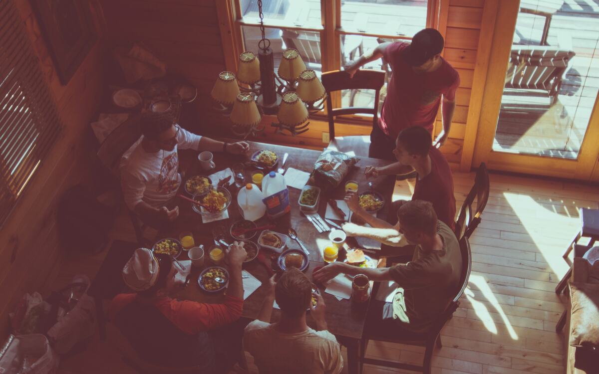 Family gathered around a table for a meal