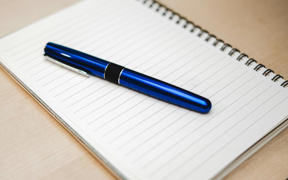 Pen resting on a notebook