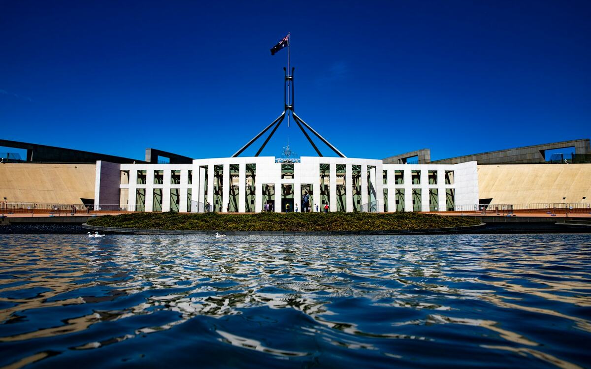 Parliament House, Canberra, reflected in the forecourt pool